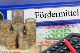 Fördermittel - Ordner mit Geld Fördermittel - Ordner mit Geld